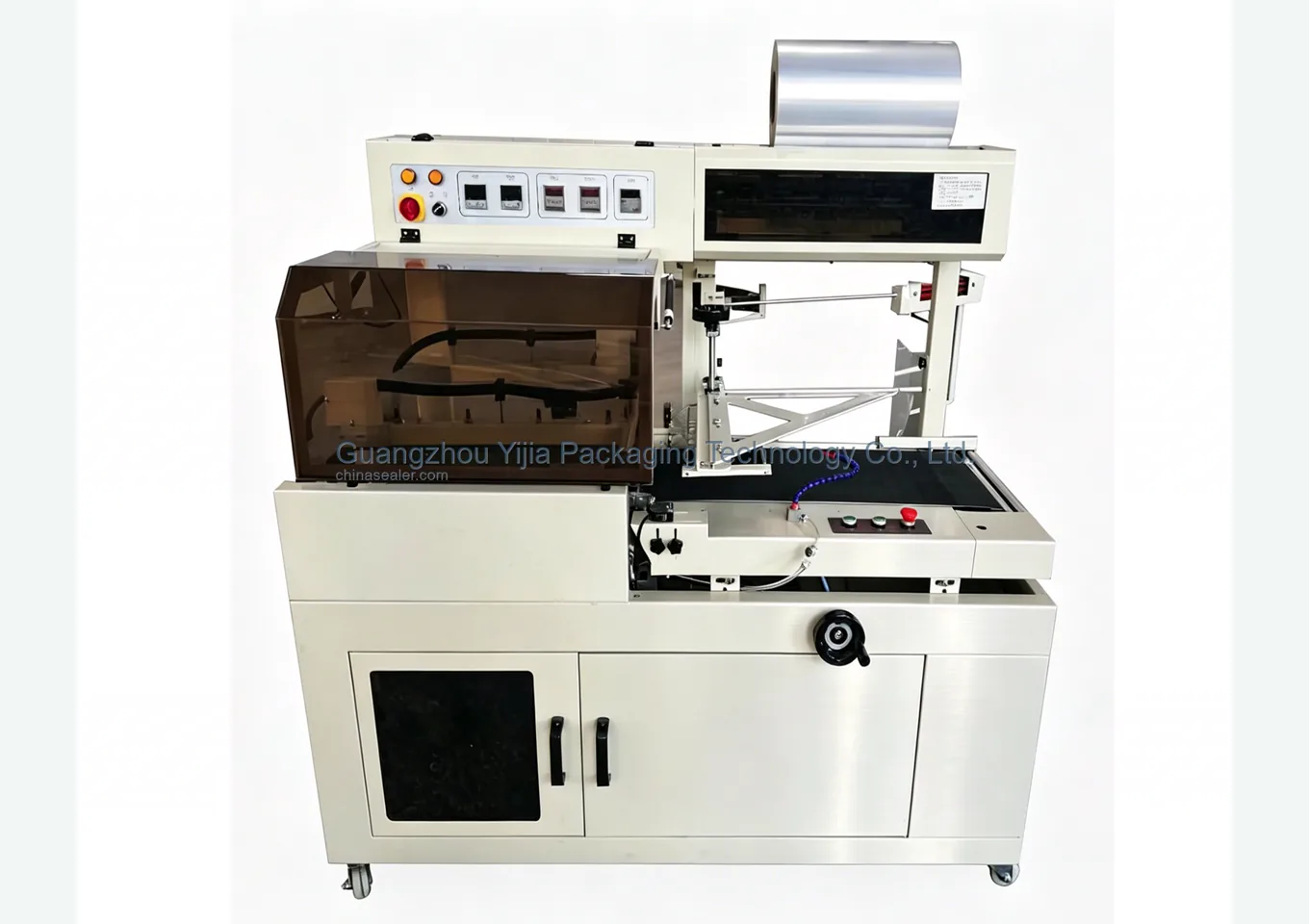Front view of L-type seal cut machine with transparent safety guard, film roll, and infeed platform