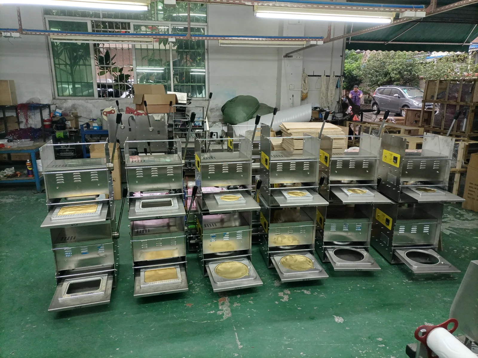Manual sealing machines and different tooling in the workshop