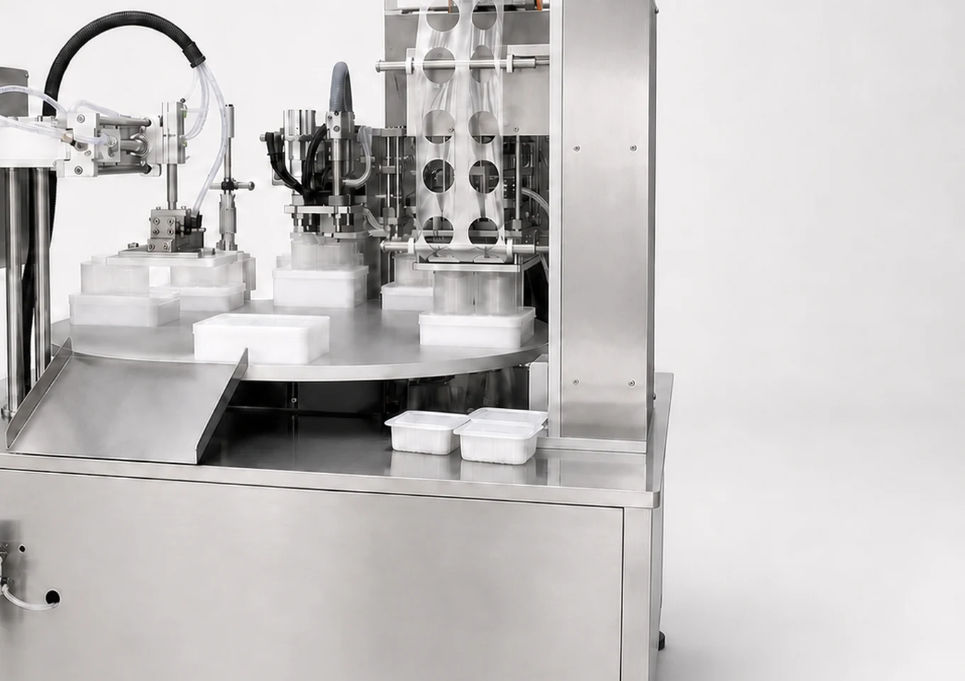 Rotary Cup Tray Filling and Sealing Machine — Outfeed or application area — AI structure illustration